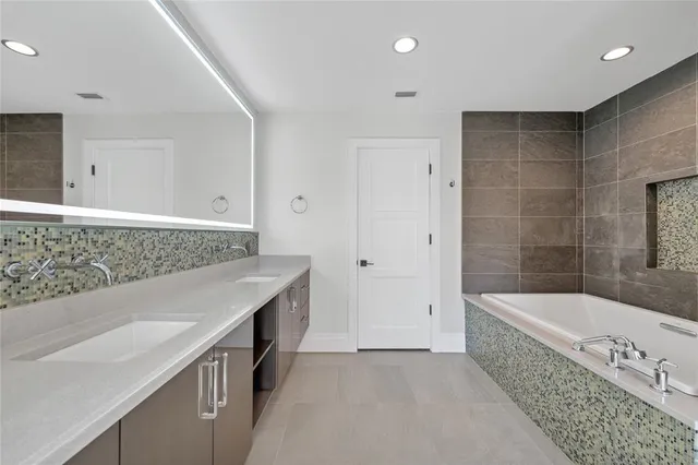 a kitchen with stainless steel appliances granite countertop a stove and a sink