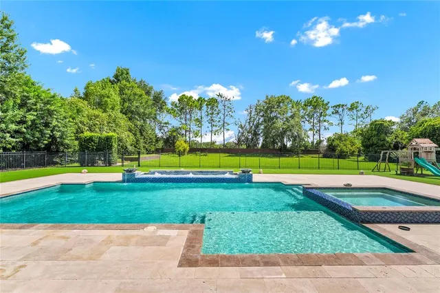 a kitchen with stainless steel appliances granite countertop a sink and a microwave