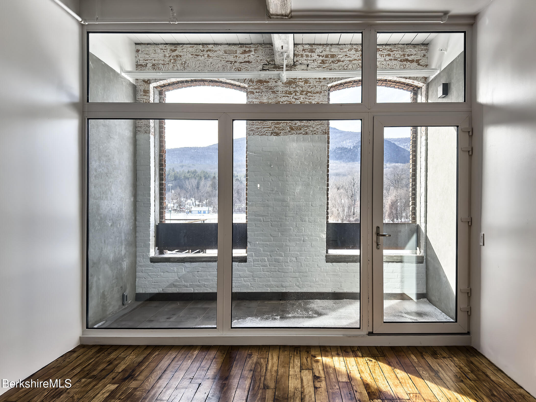 520 State Road, Unit 303 North Adams, MA 01247 - Photo 11 of 16 a view of water heater room with wooden floor