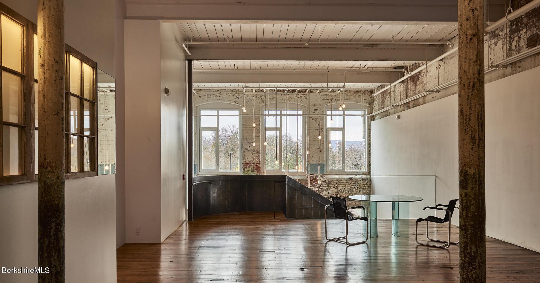 520 State Road, Unit 303 North Adams, MA 01247 - Photo 5 of 16 a view of a room with wooden floor and door