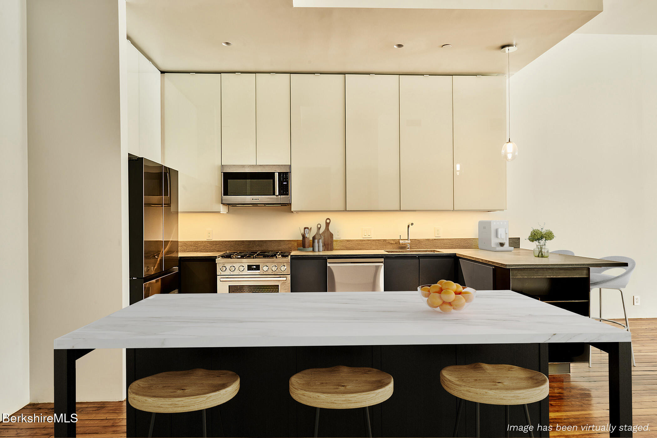 520 State Road, Unit 303 North Adams, MA 01247 - Photo 8 of 16 a kitchen with cabinets table and chairs