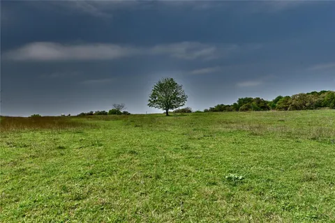 a view of a water with a yard