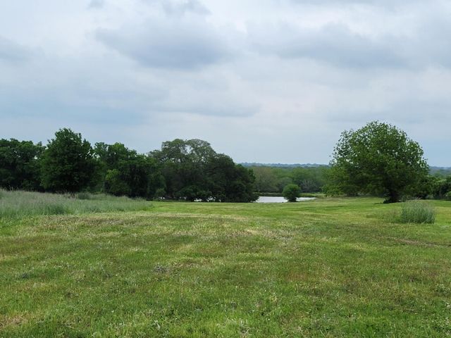 a view of a city with lush green forest