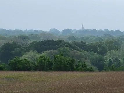 a view of a patio with a yard