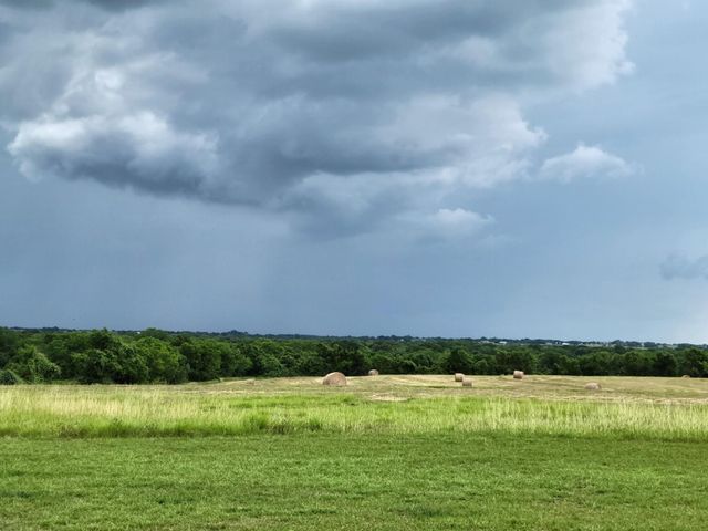 a view of a large body of water with a house in the background