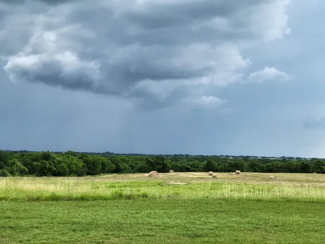 a view of a large body of water with a house in the background