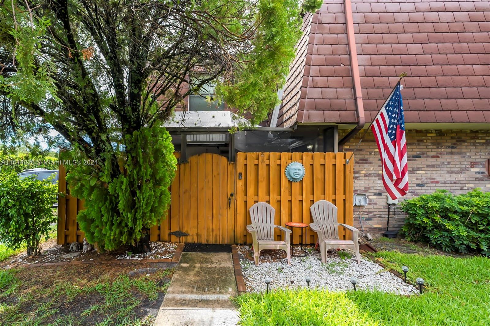a backyard of a house with seating space