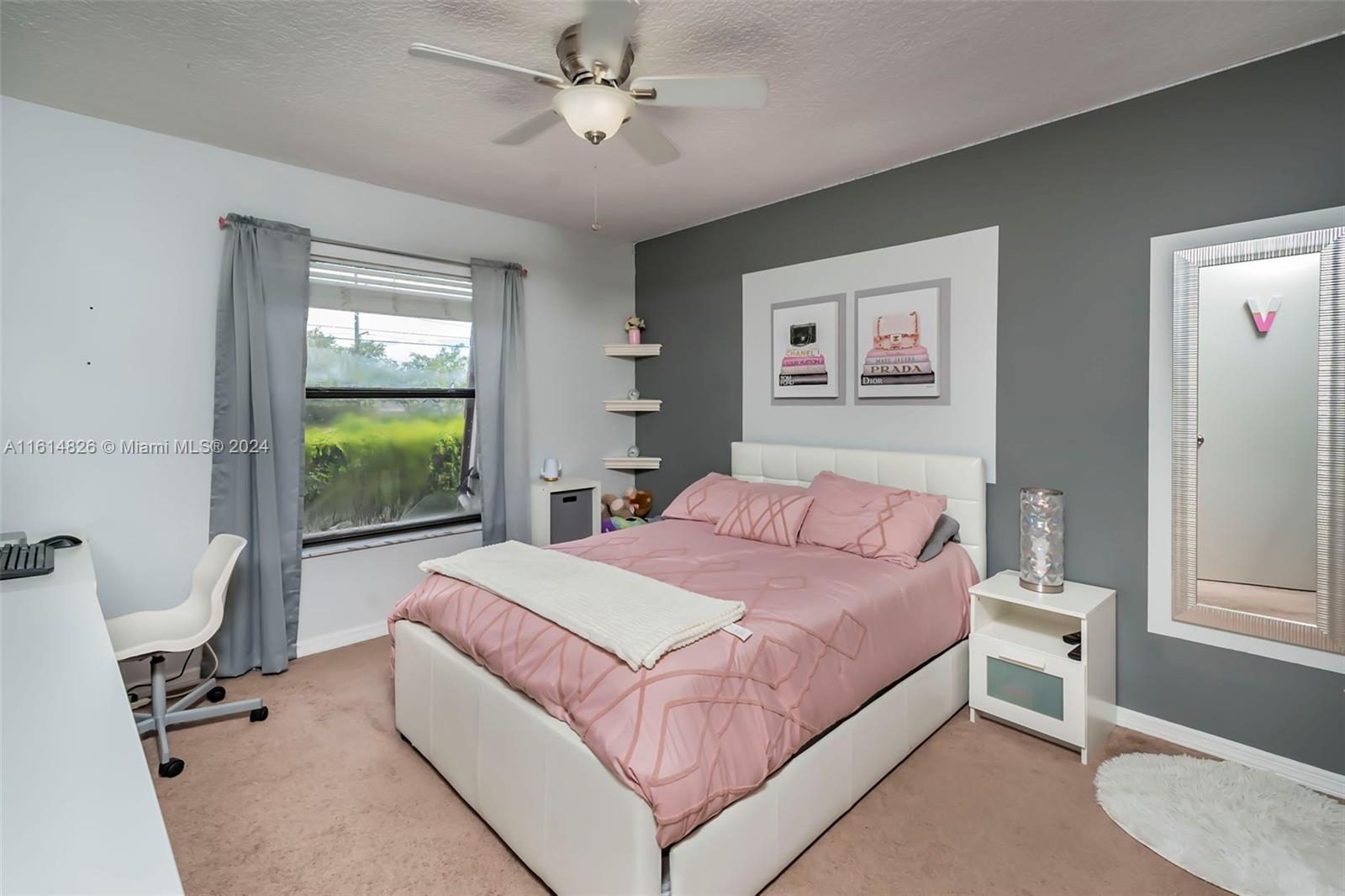 7643 Courtyard Run West Boca Raton, FL 33433 - Photo 16 of 35 a bedroom with a large bed and a window