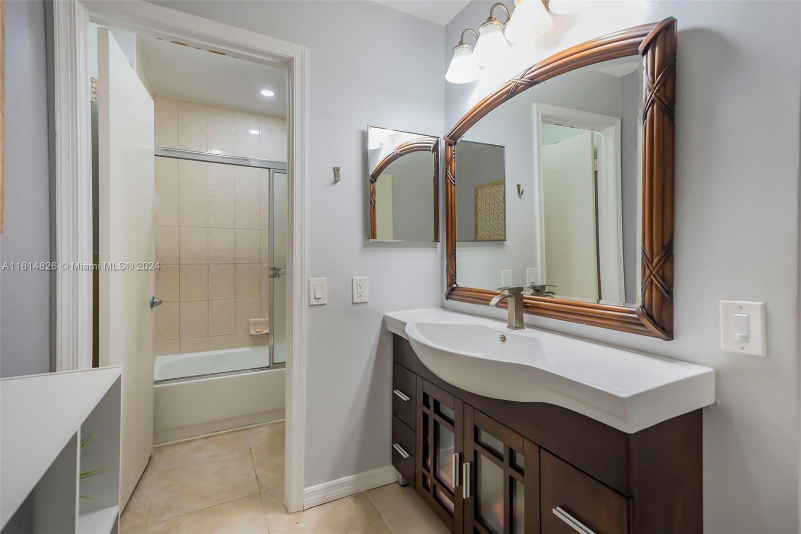 7643 Courtyard Run West Boca Raton, FL 33433 - Photo 20 of 35 a bathroom with a sink and a mirror