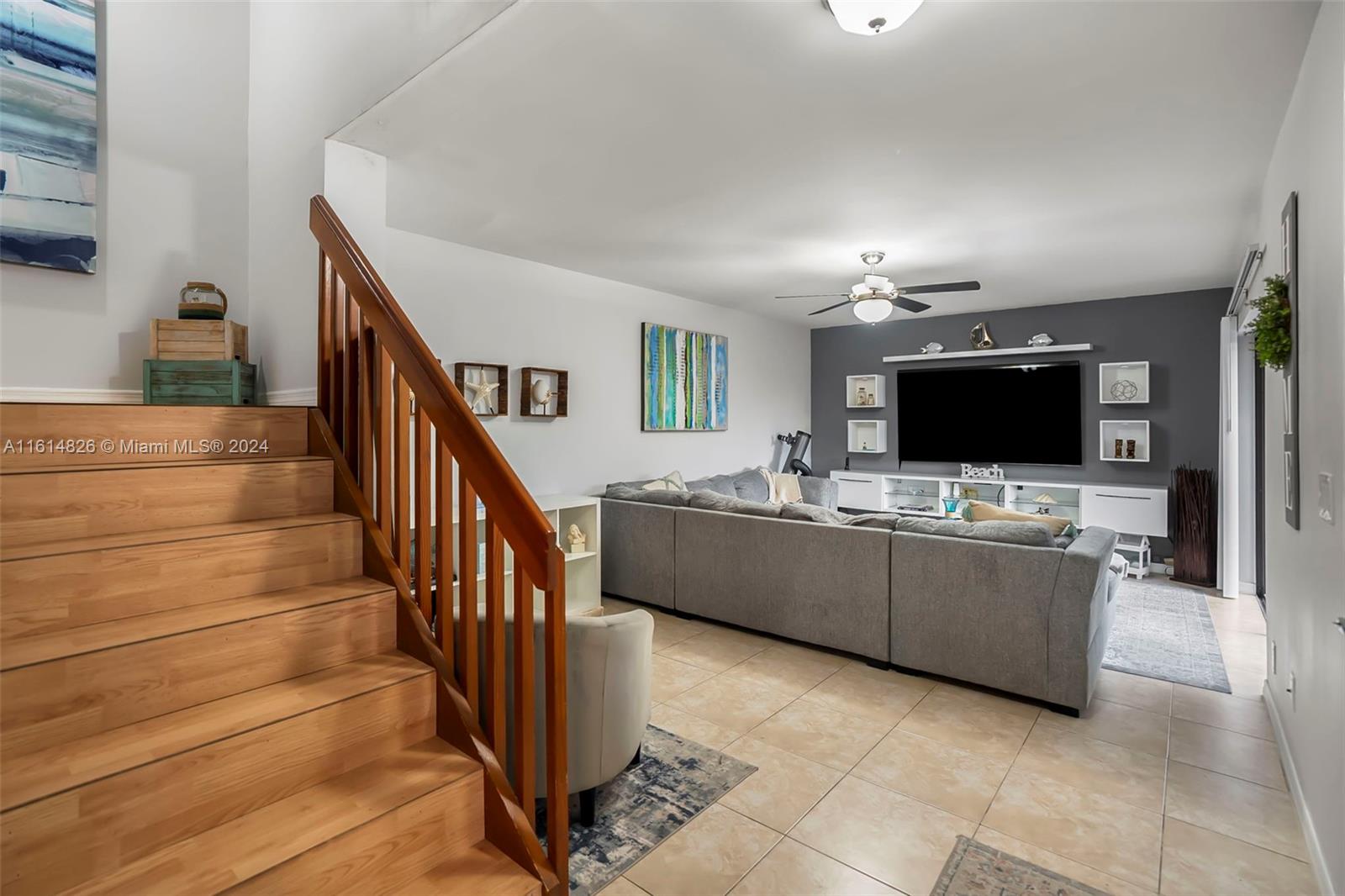 7643 Courtyard Run West Boca Raton, FL 33433 - Photo 3 of 35 a living room with furniture and a flat screen tv