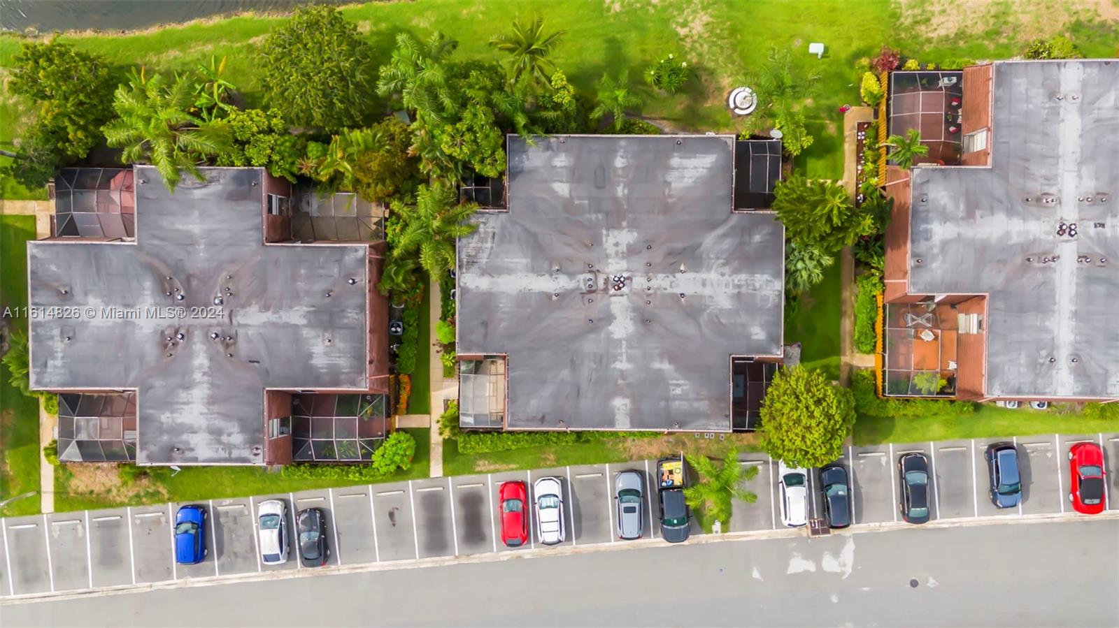 7643 Courtyard Run West Boca Raton, FL 33433 - Photo 32 of 35 front view of a brick building with a small yard