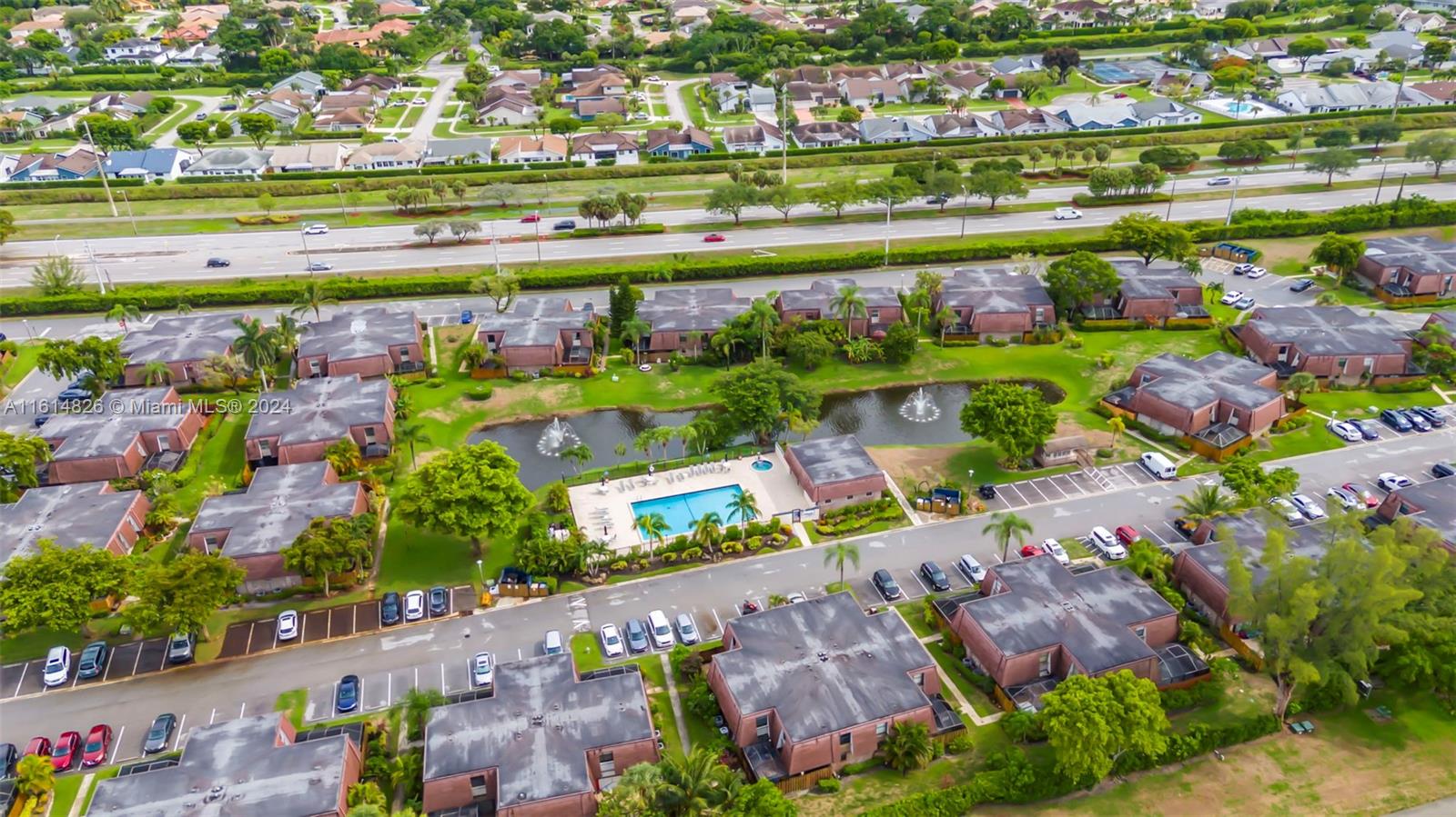 7643 Courtyard Run West Boca Raton, FL 33433 - Photo 35 of 35 an aerial view of a city with lots of residential buildings ocean and mountain view in back