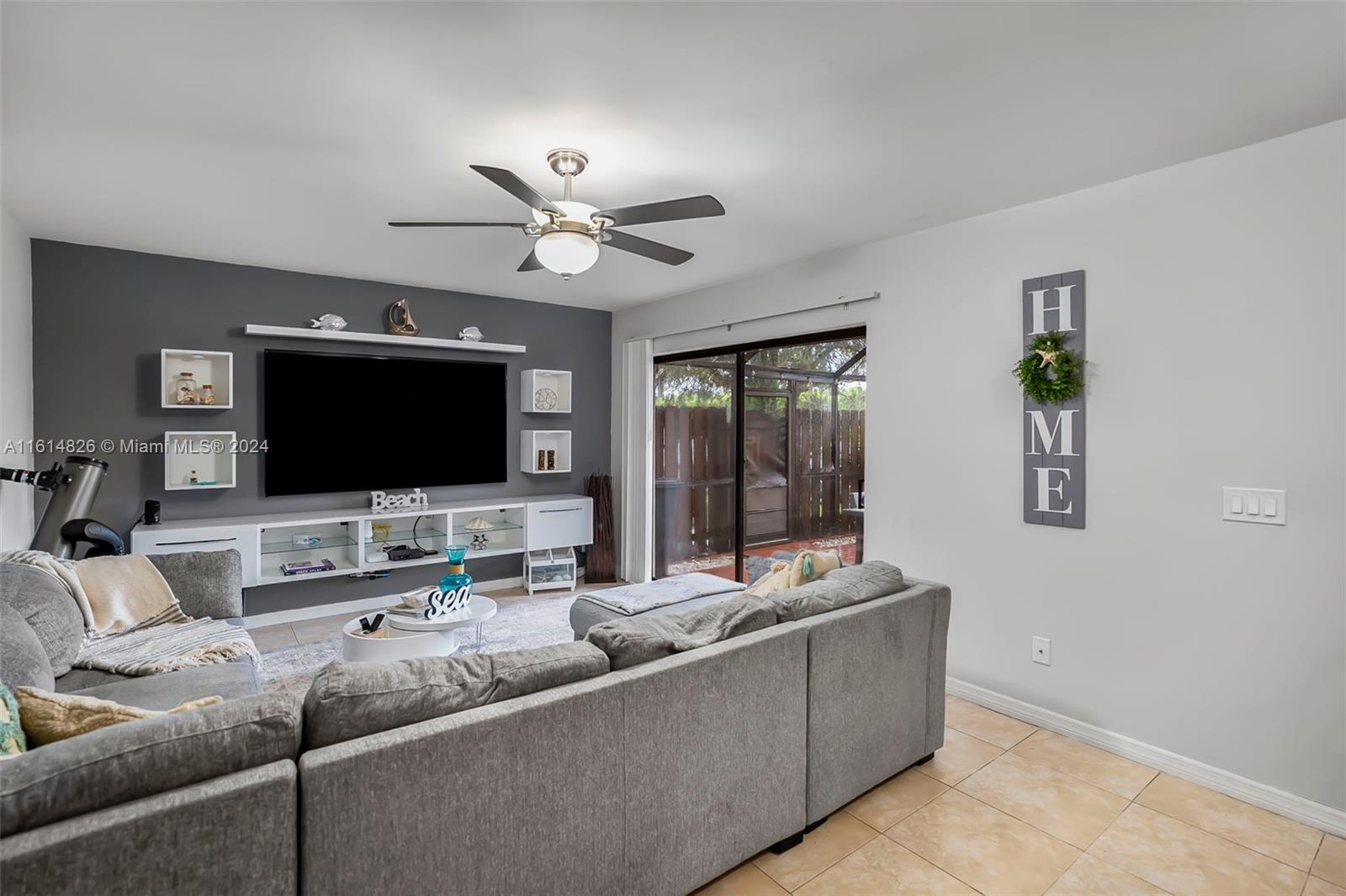 7643 Courtyard Run West Boca Raton, FL 33433 - Photo 5 of 35 a living room with furniture and a flat screen tv