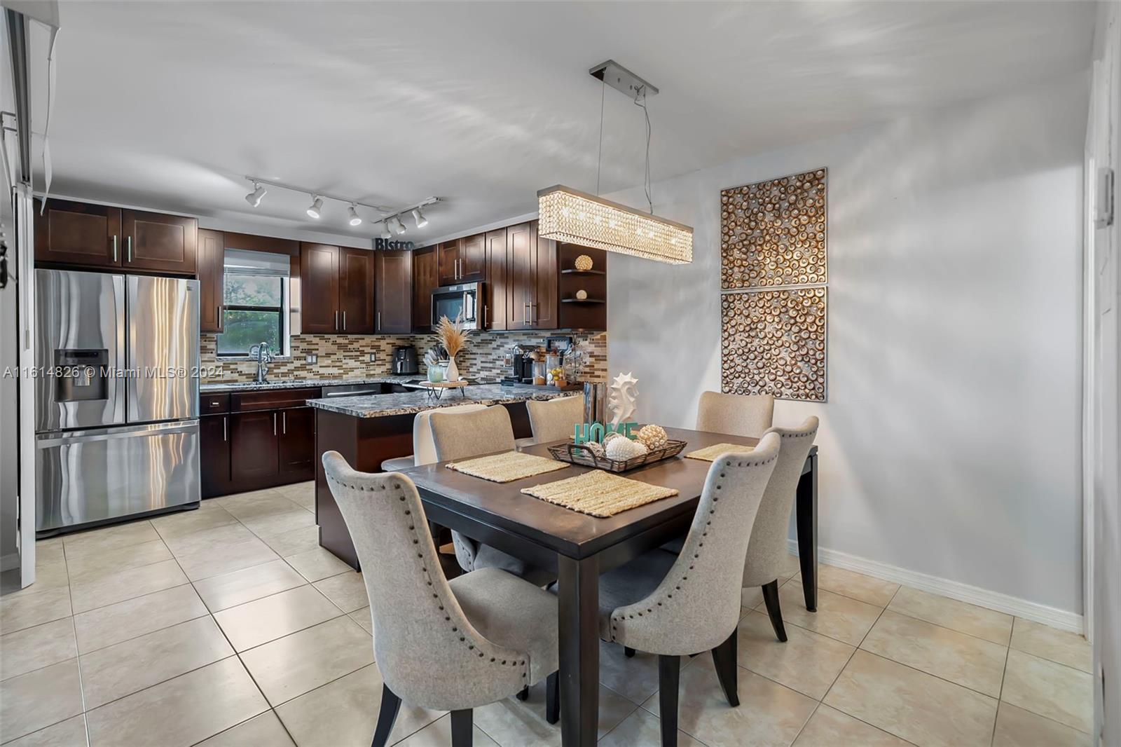 7643 Courtyard Run West Boca Raton, FL 33433 - Photo 9 of 35 a view of a dining room with furniture
