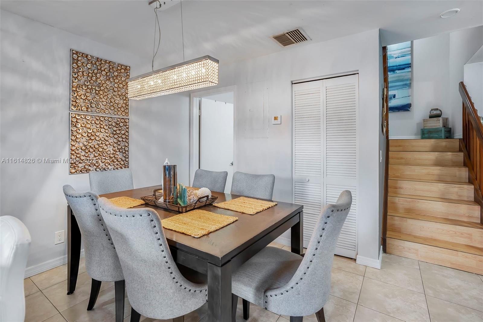 7643 Courtyard Run West Boca Raton, FL 33433 - Photo 10 of 35 a view of a dining table and chairs in a room
