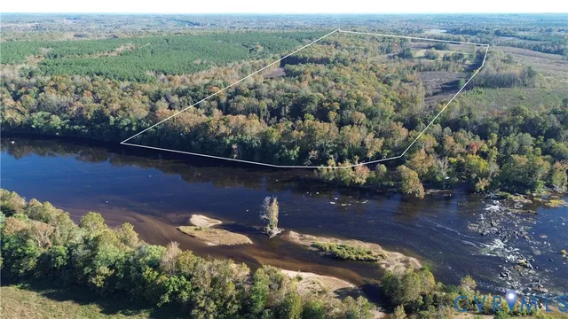 an aerial view of house with yard swimming pool and outdoor seating
