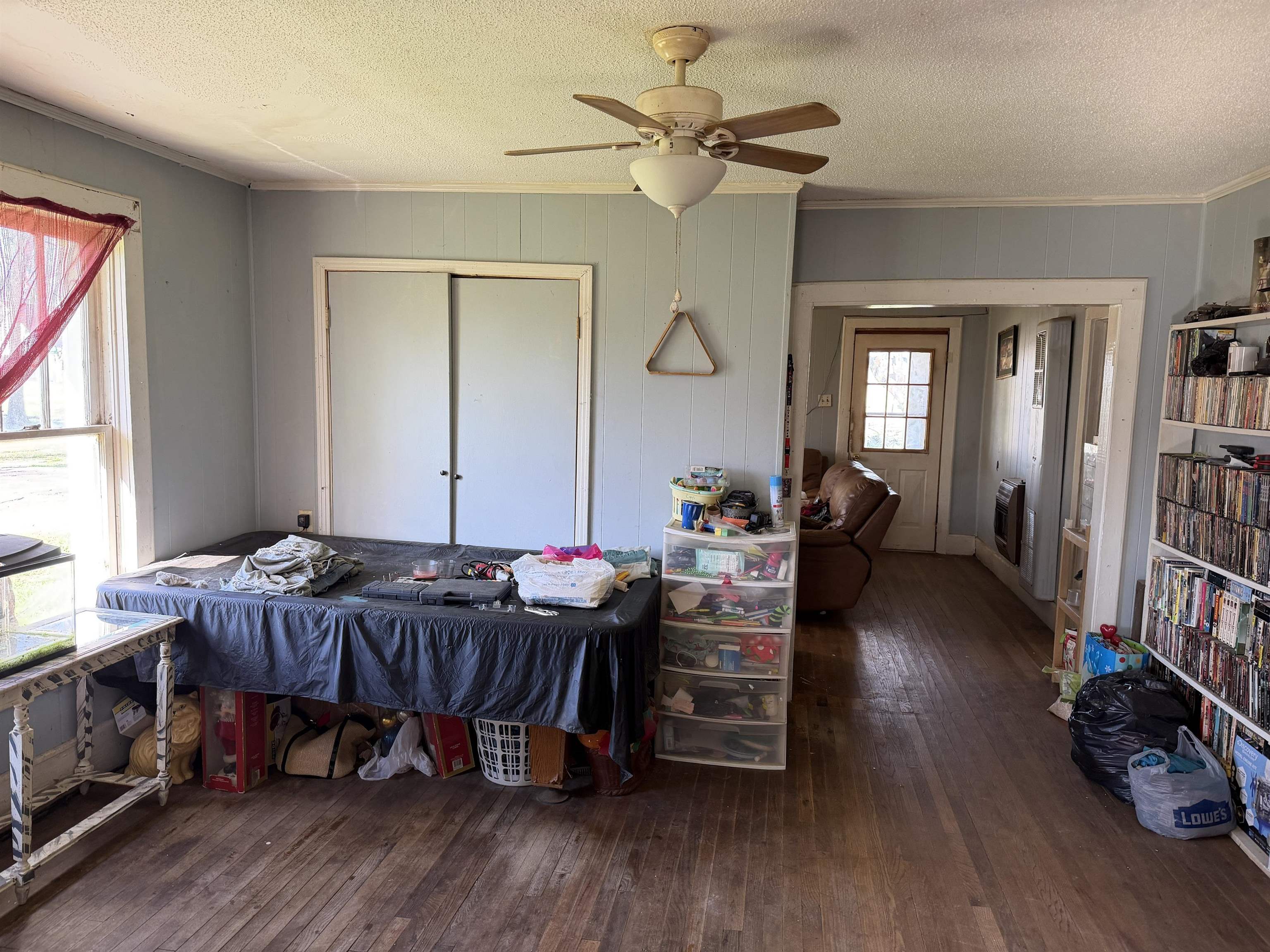 690 Patterson Road Savannah, TN 38372 - Photo 7 of 26 a bedroom with furniture and a wooden floor