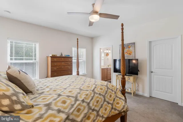 a bedroom with a bed and a lamp on table
