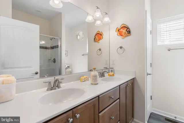 a house with green field in front of it