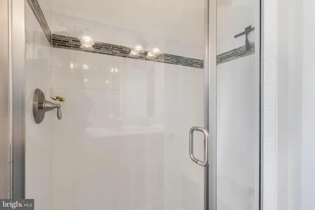 a view of a house with a big yard and potted plants in front of the house