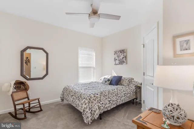 an aerial view of a house with outdoor space and a garden
