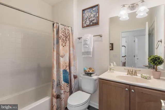an aerial view of a swimming pool with outdoor seating