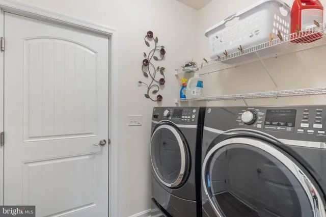 an aerial view of residential houses with swimming pool