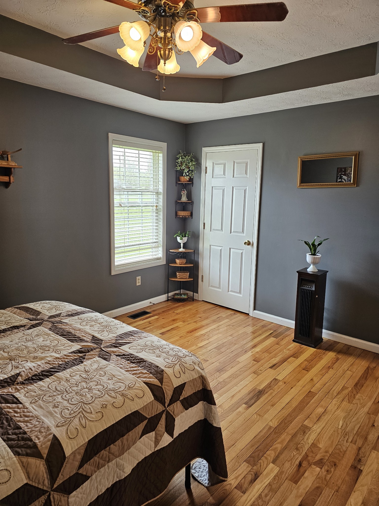 285 Browns Road Lafayette, TN 37083 - Photo 11 of 30 a bedroom with a bed and a chandelier