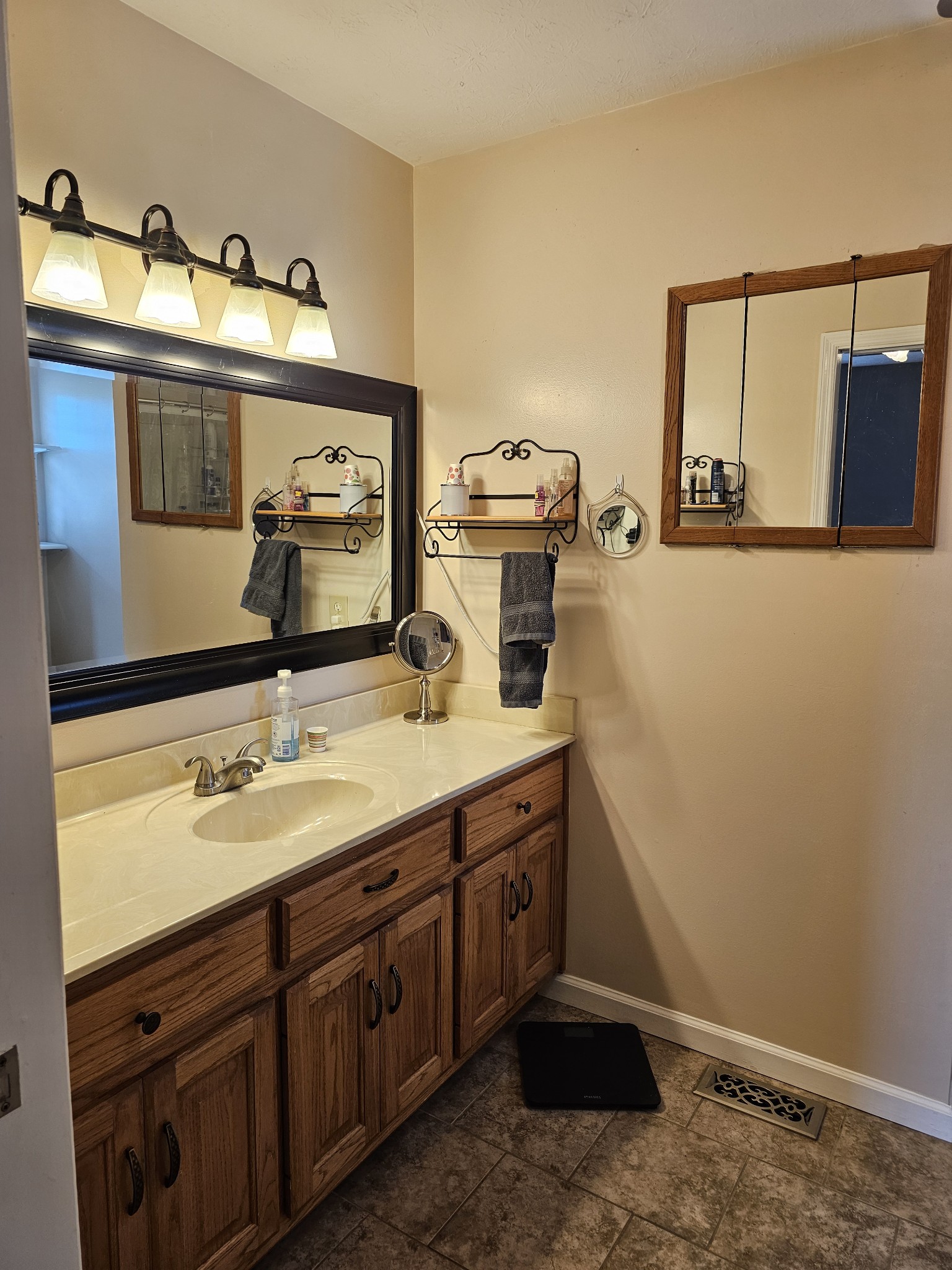 285 Browns Road Lafayette, TN 37083 - Photo 13 of 30 a bathroom with a sink and a mirror