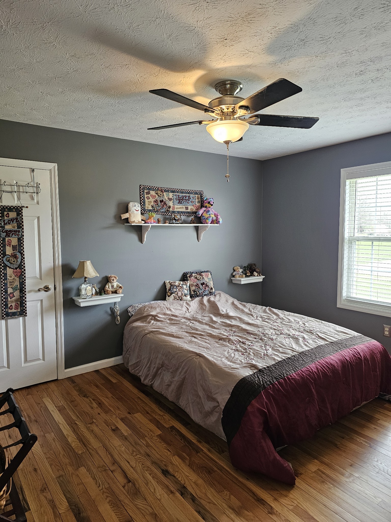 285 Browns Road Lafayette, TN 37083 - Photo 17 of 30 a bedroom with a bed and a chandelier