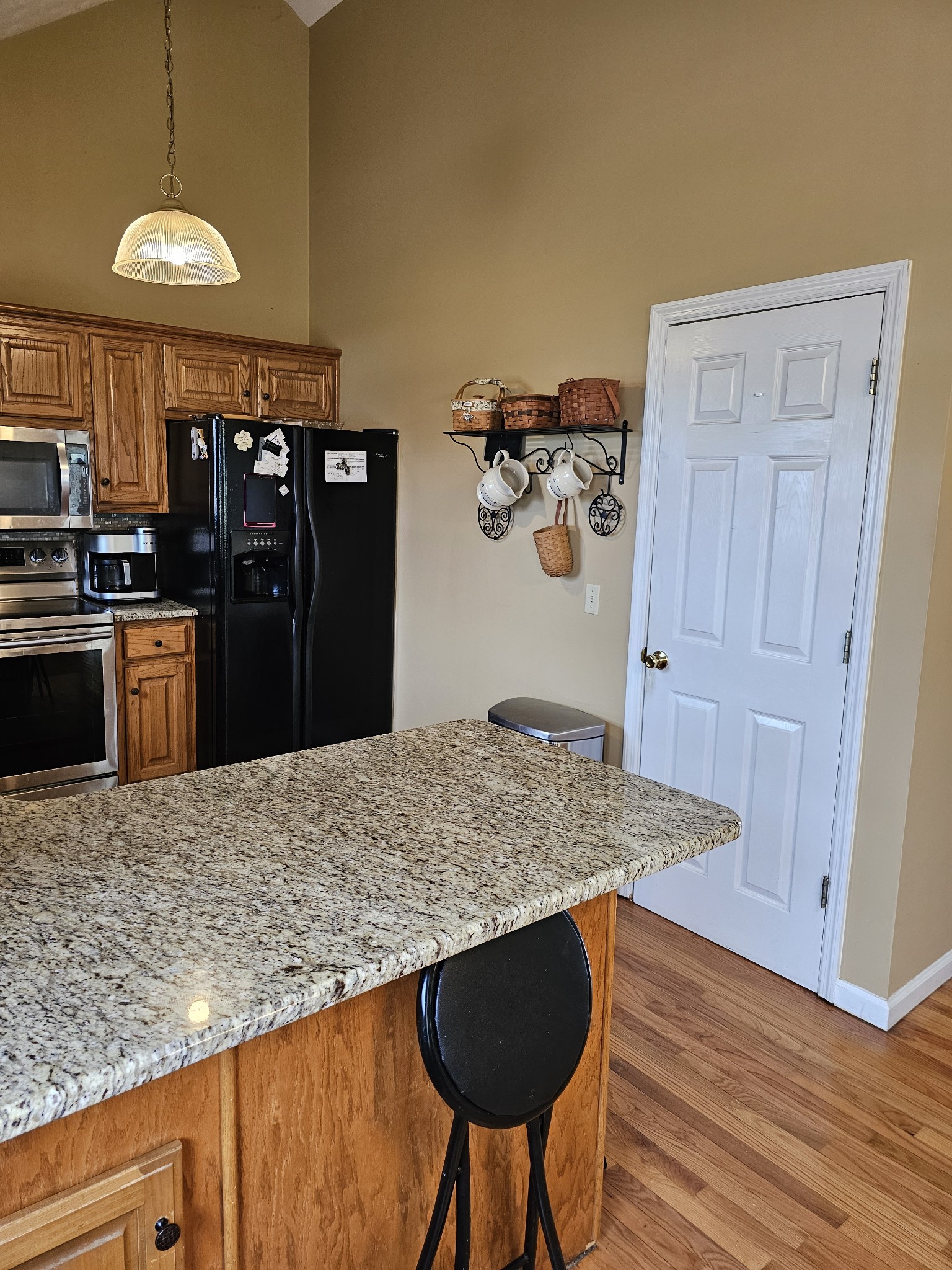 285 Browns Road Lafayette, TN 37083 - Photo 5 of 30 a kitchen with a table and refrigerator