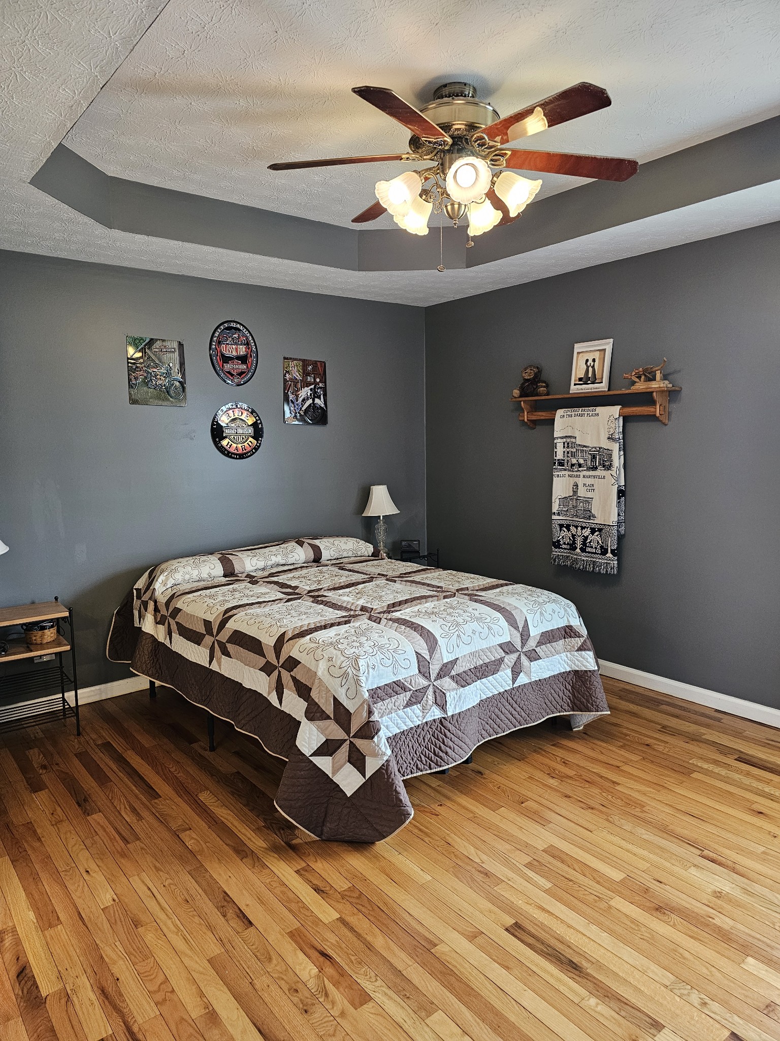285 Browns Road Lafayette, TN 37083 - Photo 10 of 30 a bedroom with a bed and a chandelier