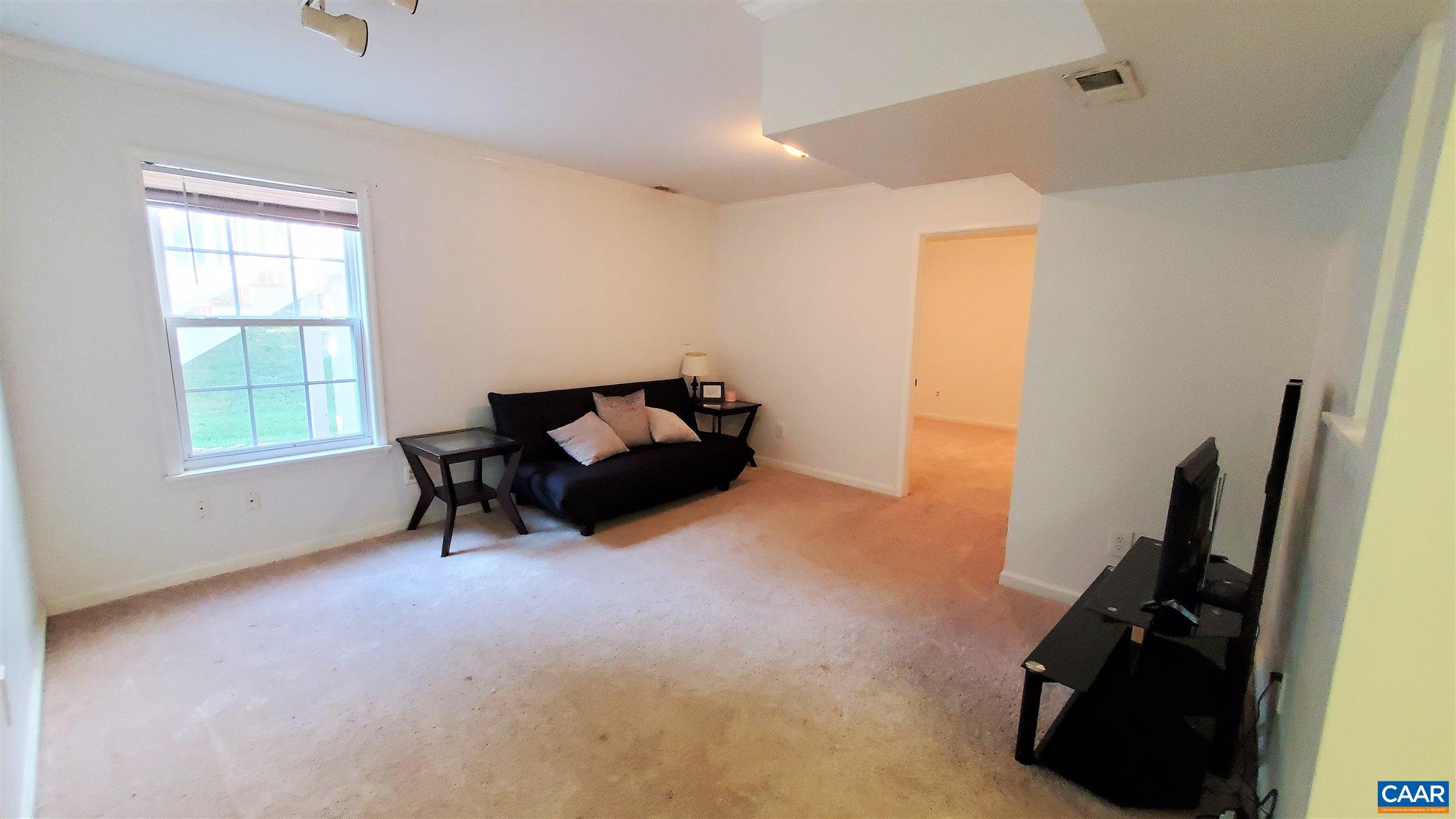 26 Xebec Road Palmyra, VA 22963 - Photo 16 of 21 a living room with furniture and a window