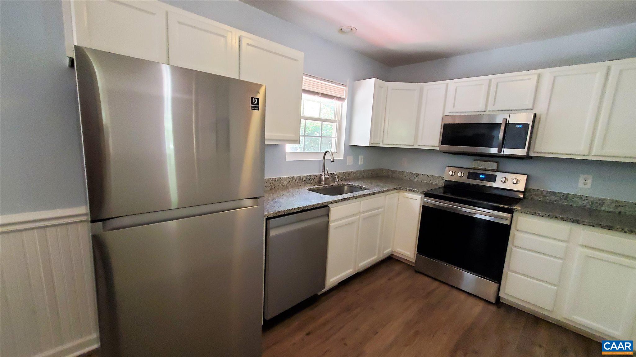 26 Xebec Road Palmyra, VA 22963 - Photo 5 of 21 a kitchen with a refrigerator stove and microwave