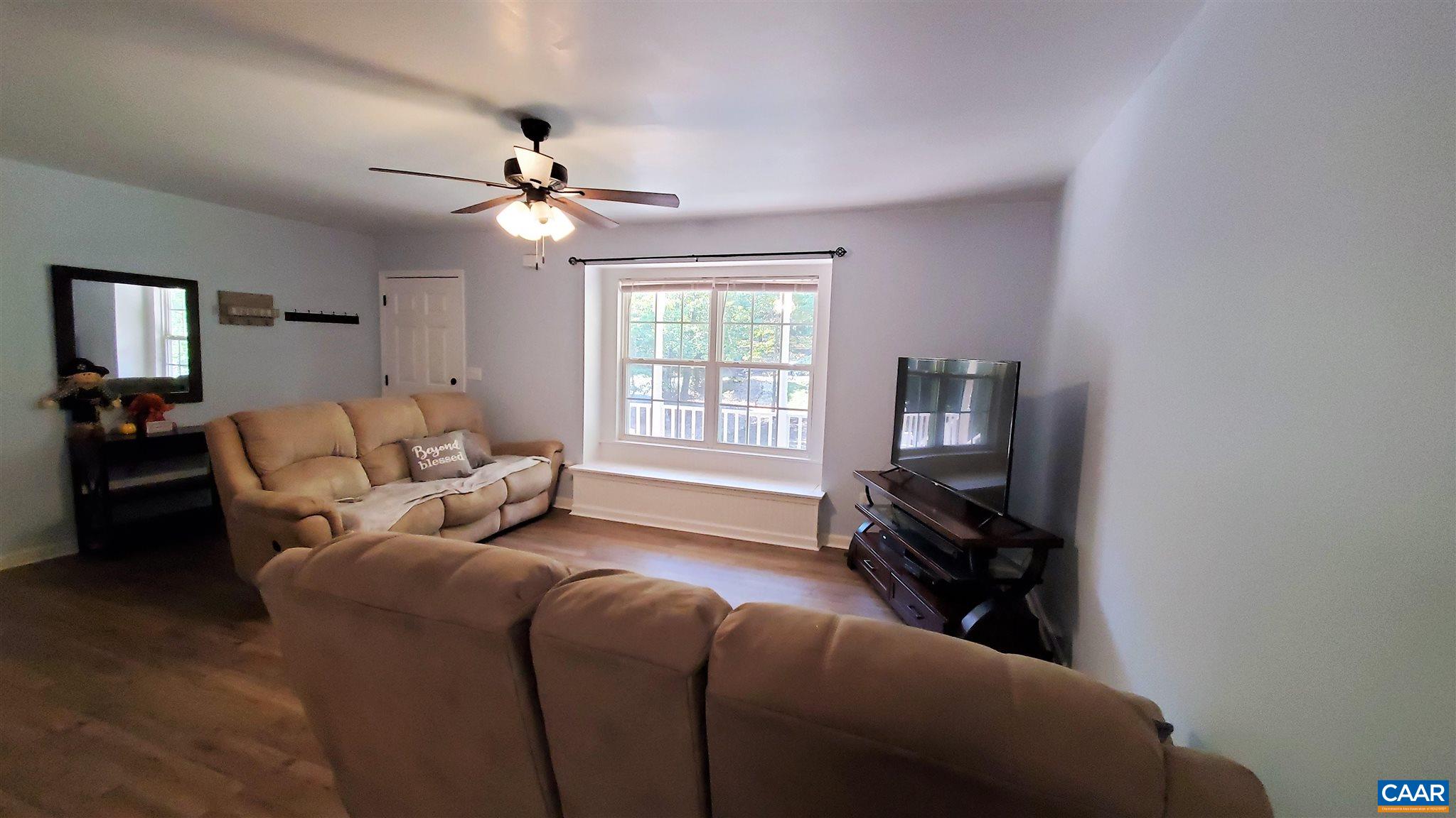 26 Xebec Road Palmyra, VA 22963 - Photo 8 of 21 a living room with furniture a ceiling fan and a window