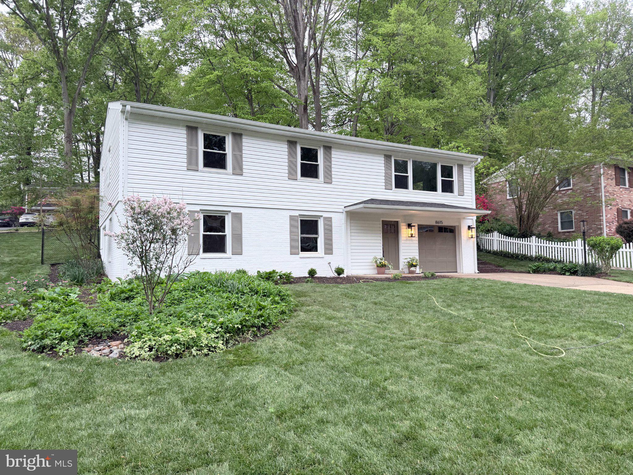 8615 Kerry Lane Springfield, VA 22152 - Photo 1 of 50 a front view of a house with garden