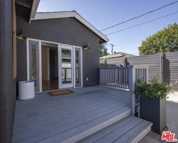 a view of a house with porch and wooden floor
