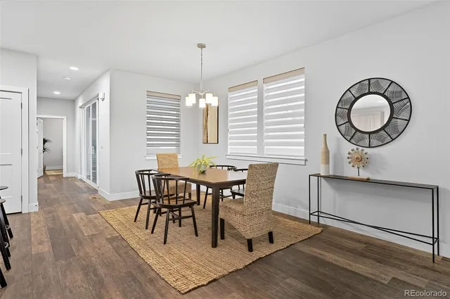 a view of a dining room with furniture and window