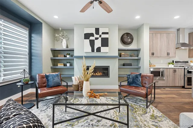 a kitchen with a dining table chairs stainless steel appliances and cabinets