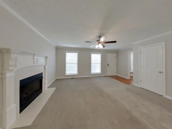 a view of empty room with a fireplace