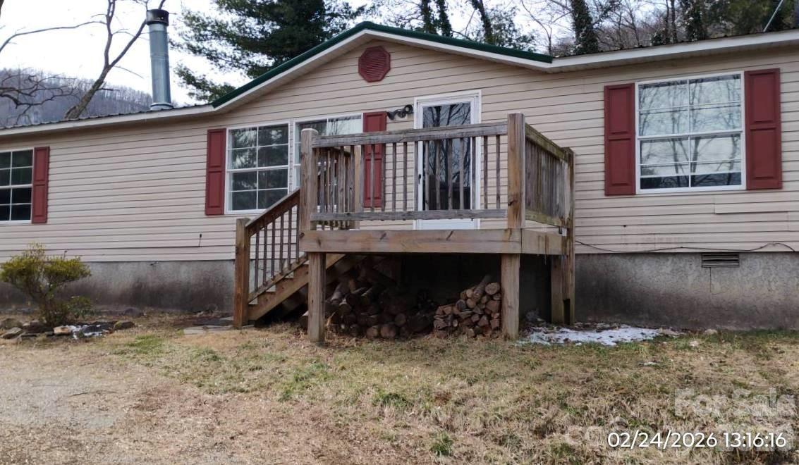 115 Paradise Mountain Road Canton, NC 28716 - Photo 3 of 12 a view of a house with a yard