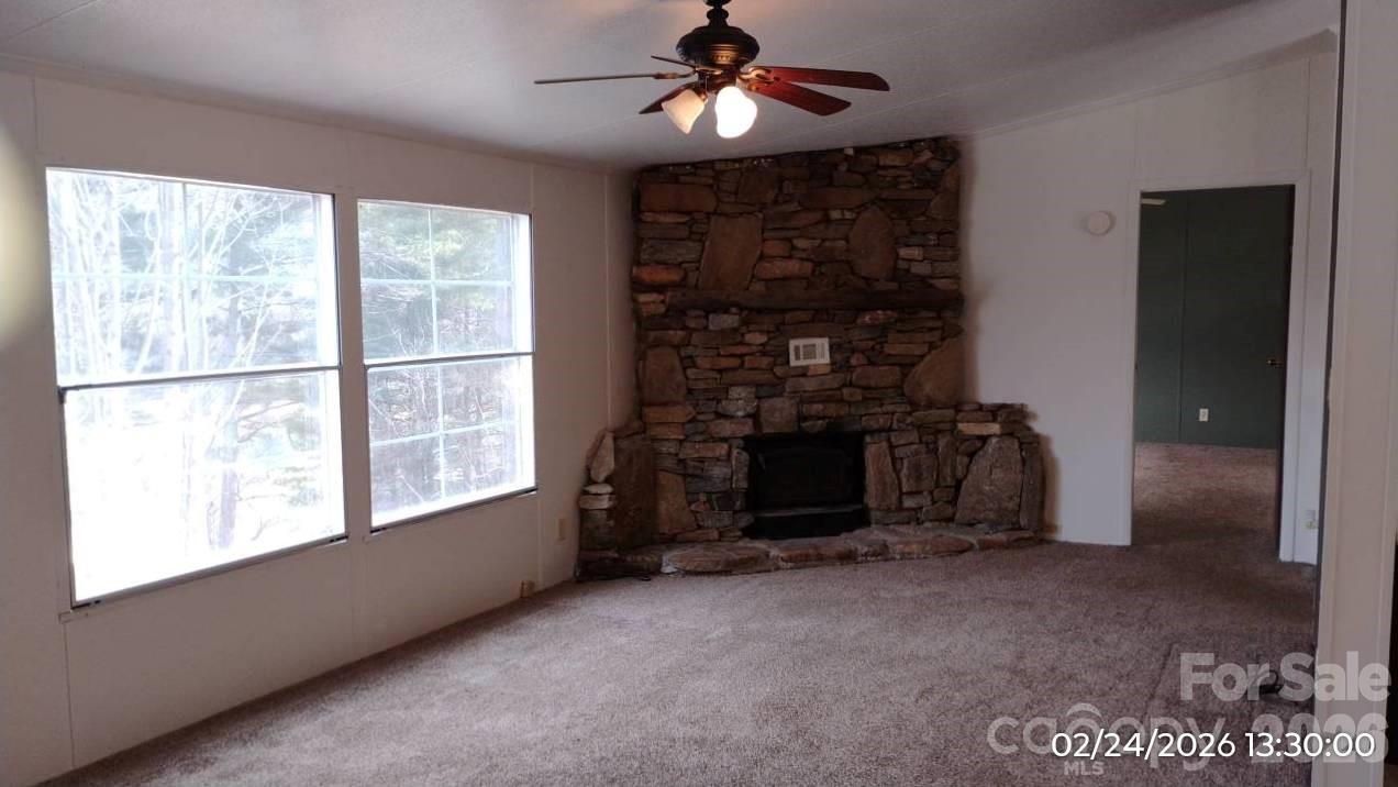 115 Paradise Mountain Road Canton, NC 28716 - Photo 4 of 12 a view of a livingroom with a fireplace
