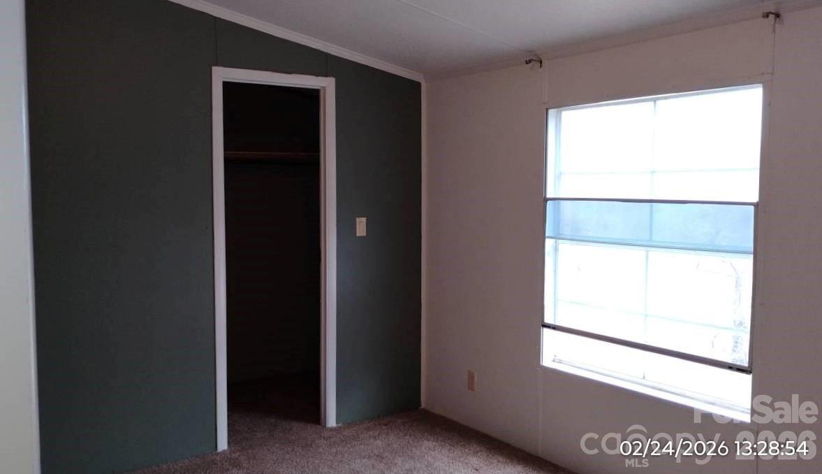 115 Paradise Mountain Road Canton, NC 28716 - Photo 9 of 12 a view of an empty room with a window