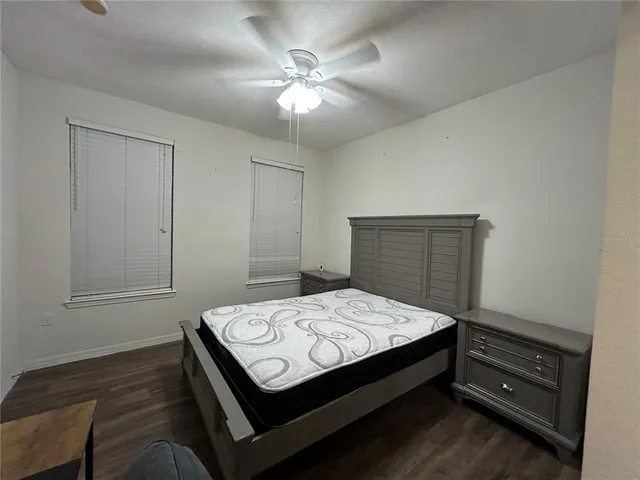 a bedroom with a bed and a dresser