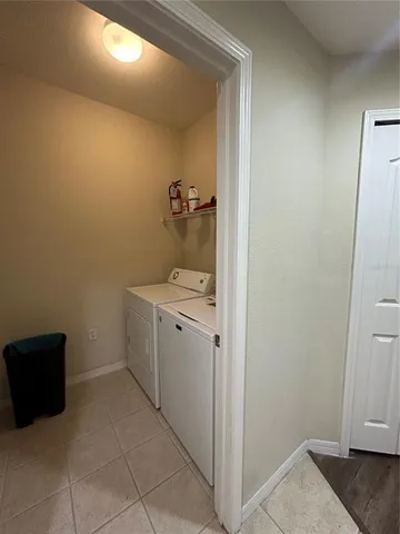 a view of a hallway to rooms