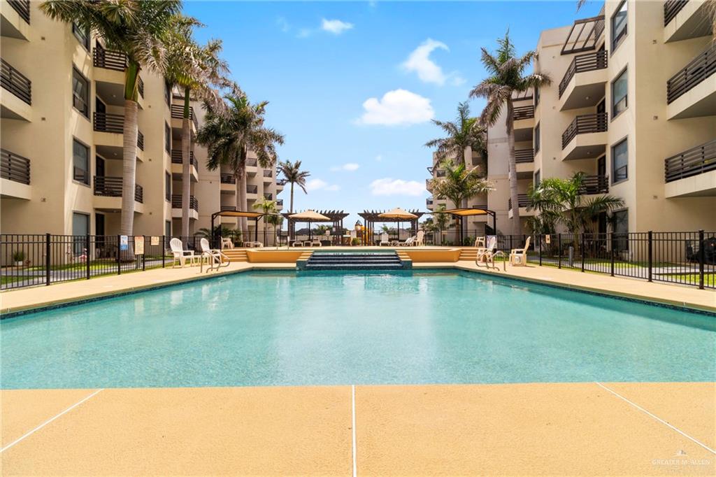 813 Travis Street, Unit 408 Mission, TX 78572 - Photo 23 of 25 a view of a lake with building