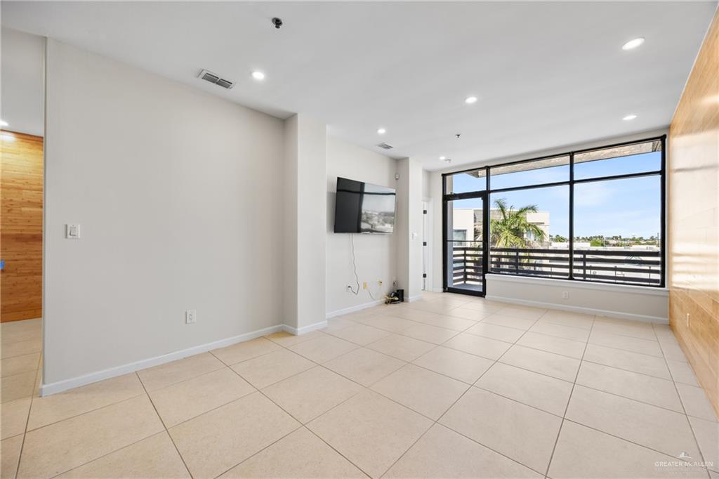 813 Travis Street, Unit 408 Mission, TX 78572 - Photo 5 of 25 a view of an empty room with a window