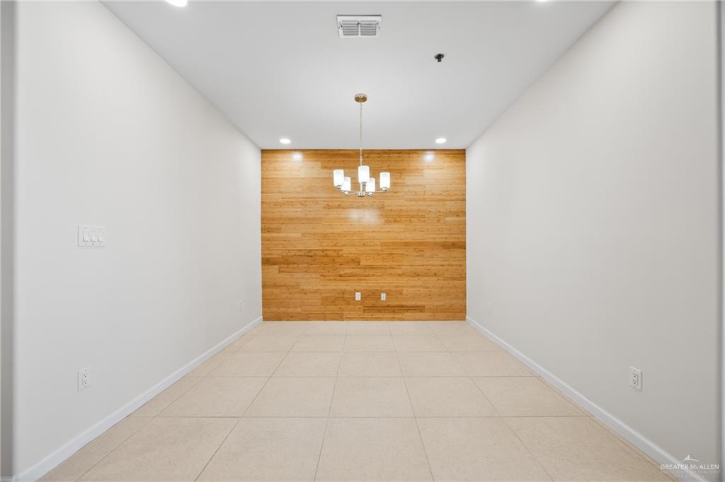 813 Travis Street, Unit 408 Mission, TX 78572 - Photo 9 of 25 a view of an empty room with a window