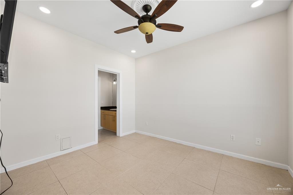 813 Travis Street, Unit 408 Mission, TX 78572 - Photo 10 of 25 wooden floor in an empty room