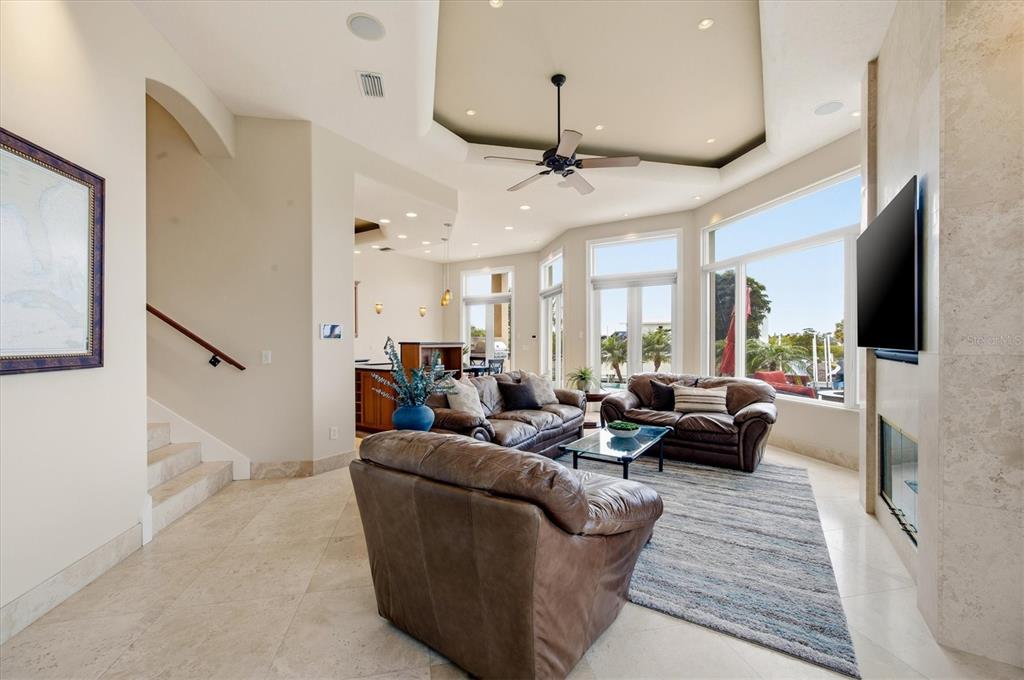 761 Norton Street Longboat Key, FL 34228 - Photo 15 of 66 a living room with furniture wooden floor and a flat screen tv